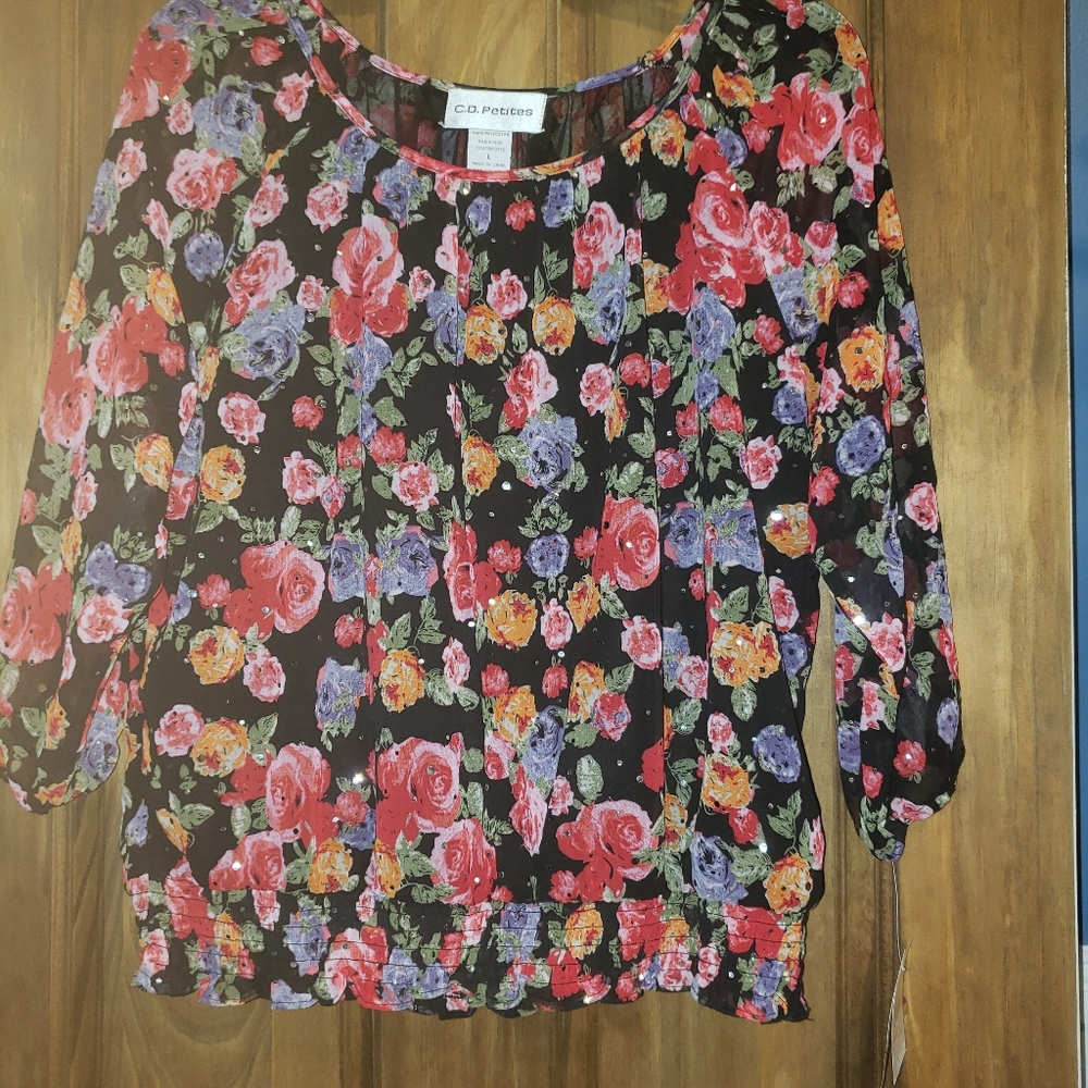 Ladie's floral pullover blouse with bling.